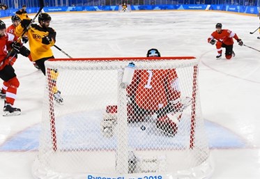 GANGNEUNG, SOUTH KOREA - FEBRUARY 20: Germany's Leonhard Pfoderl #83 gets the puck past Switzerland's Jonas Hiller #1 to score a first period goal with Philippe Furrer #54, Gaetan Haas #92 and Germany's Felix Schutz #55 looking on during qualification playoff round action at the PyeongChang 2018 Olympic Winter Games. (Photo by Matt Zambonin/HHOF-IIHF Images)

